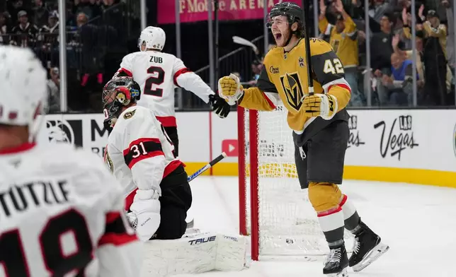 Vegas Golden Knights right wing Braeden Bowman (42) celebrates after scoring against Ottawa Senators goaltender Jonas Johansson (31) during the second period of an NHL hockey game Tuesday, Oct. 27, 2026, in Las Vegas. (AP Photo/John Locher)