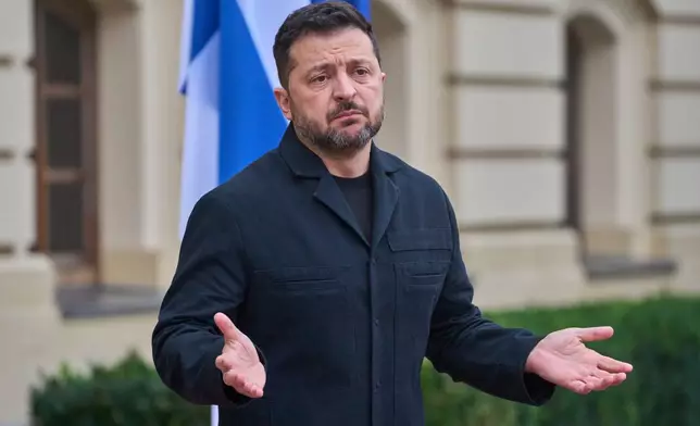 Ukraine's President Volodymyr Zelenskyy answers media questions before his meeting with Finnish Prime Minister Petteri Orpo in Kyiv, Ukraine, Thursday Oct. 22, 2026. (AP Photo/Efrem Lukatsky)