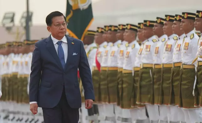 Myanmar's President Min Aung Hlaing inspects an honor guard during a welcoming ceremony ahead of his meeting with Malaysia's Prime Minister Anwar Ibrahim during his visit at the Prime Minister's Office in Putrajaya, Malaysia, Thursday, Oct. 8, 2026. (AP Photo/Azneal Ishak, Pool)
