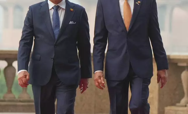 Myanmar's President Min Aung Hlaing, left, walks with Malaysia's Prime Minister Anwar Ibrahim during their meeting in Putrajaya, Malaysia, Thursday, Oct. 8, 2026. (AP Photo/Azneal Ishak, Pool)