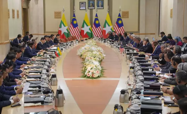 Myanmar's President Min Aung Hlaing, left, and Malaysian's Prime Minister Anwar Ibrahim, right, attend a bilateral meeting in Putrajaya, Malaysia, Thursday, Oct. 8, 2026. (AP Photo/Azneal Ishak, Pool)