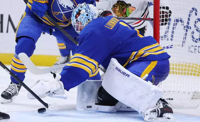 Buffalo Sabres goaltender Ukko-Pekka Luukkonen (1) cover a puck in traffic during the second period of an NHL hockey game against the Chicago Blackhawks Saturday, Oct. 3, 2026, in Buffalo, N.Y. (AP Photo/Jeffrey T. Barnes)