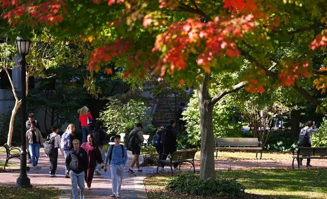 Students walk on the campus of Villanova University in Villanova, Pa., Wednesday, Oct. 21, 2026. (AP Photo/Matt Rourke)