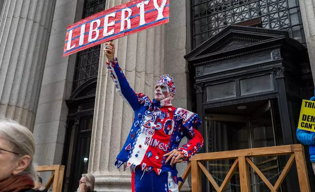 Protesters gather for a "No Kings" rally on Saturday, Oct. 17, 2026, in New York. (AP Photo/Madison Swart)