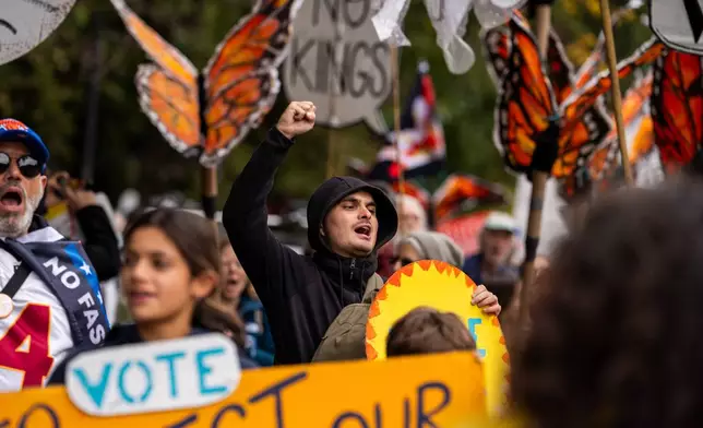 Protesters gather for a "No Kings" rally on Saturday, Oct. 17, 2026, in New York. (AP Photo/Madison Swart)