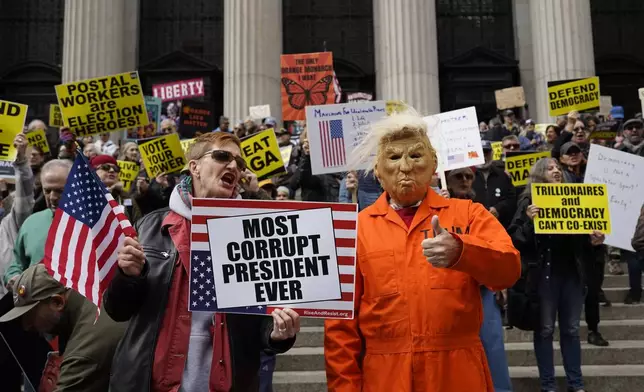 Protesters gather for a "No Kings" rally on Saturday, Oct. 17, 2026, in New York. (AP Photo/Madison Swart)
