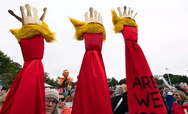 Demonstrators march to the Lincoln Memorial during a "No Kings" protest in Washington, Saturday, Oct. 17, 2026. (AP Photo/Jose Luis Magana)