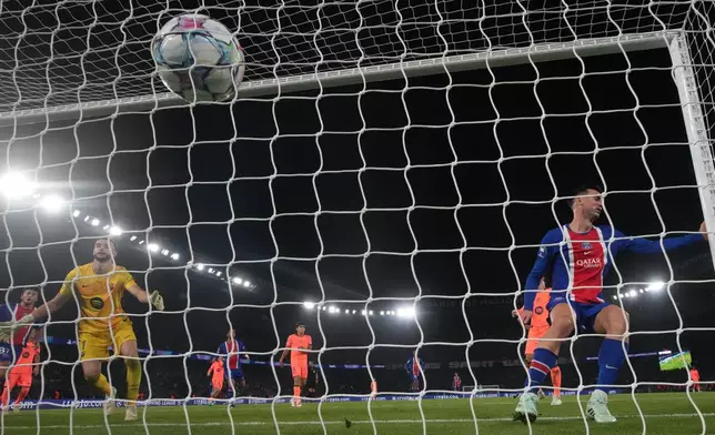 PSG's Fabian Ruiz scores their fourth goal during the Champions League opening phase soccer match between Paris Saint-Germain and FC Barcelona in Paris, Tuesday, Oct. 20, 2026. (AP Photo/Teresa Suarez)