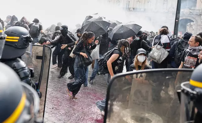 Riot police use a water cannon as they face students during a protest against under-resourced schools, in Rennes, western France, Tuesday, Oct. 6, 2026. (AP Photo/Jeremias Gonzalez)