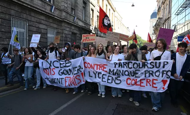 High school students march during a protest against under-resourced schools, in Bordeaux, France, Tuesday, Oct. 6, 2026. (AP Photo/Caroline Blumberg)