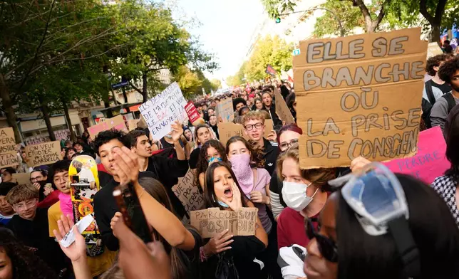 Students chant slogans during a demonstration against under-resourced schools, in Paris, Tuesday, Oct. 6, 2026. (AP Photo/Teresa Suarez)