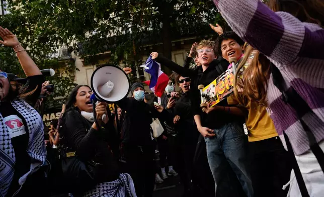 Students chant slogans during a demonstration against under-resourced schools, in Paris, Tuesday, Oct. 6, 2026. (AP Photo/Teresa Suarez)