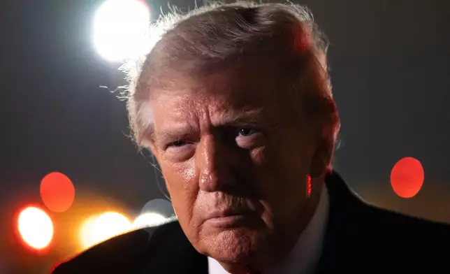 President Donald Trump speaks with reporters as he arrives on Air Force One, Saturday, Oct. 10, 2026, at Joint Base Andrews, Md. (AP Photo/Alex Brandon)