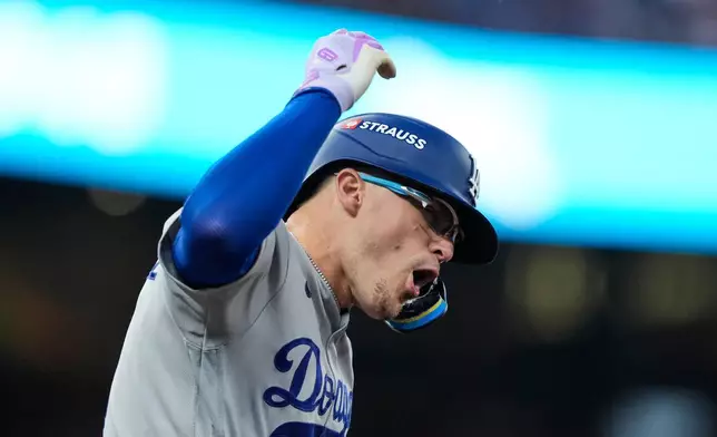 Los Angeles Dodgers' Enrique Hernández celebrates his two-run home run during the fourth inning in Game 3 of baseball's National League Division Series against the Atlanta Braves, Tuesday, Oct. 6, 2026, in Atlanta. (AP Photo/Brynn Anderson)