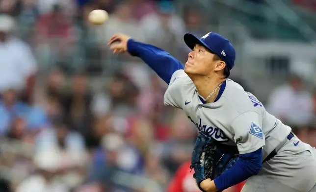 Los Angeles Dodgers' Yoshinobu Yamamoto throws to the Atlanta Braves during the third inning in Game 3 of baseball's National League Division Series, Tuesday, Oct. 6, 2026, in Atlanta. (AP Photo/Brynn Anderson)