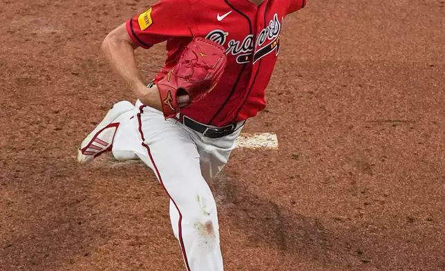 Atlanta Braves pitcher Chris Sale throws to the Los Angeles Dodgers during the second inning in Game 3 of baseball's National League Division Series, Tuesday, Oct. 6, 2026, in Atlanta. (AP Photo/Mike Stewart)