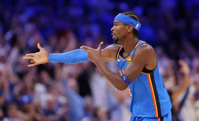 Oklahoma City Thunder guard Shai Gilgeous-Alexander celebrates after making a basket during the second half of an NBA basketball game against the Denver Nuggets, Thursday, Oct. 22, 2026, in Oklahoma City. (AP Photo/Nate Billings)