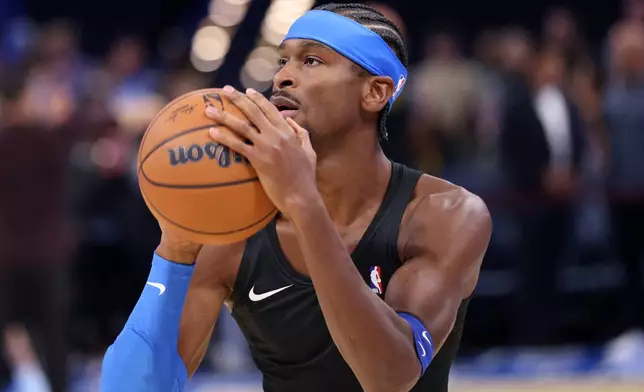 Oklahoma City Thunder guard Shai Gilgeous-Alexander warms up before an NBA basketball game against the Denver Nuggets, Thursday, Oct. 22, 2026, in Oklahoma City. (AP Photo/Nate Billings)