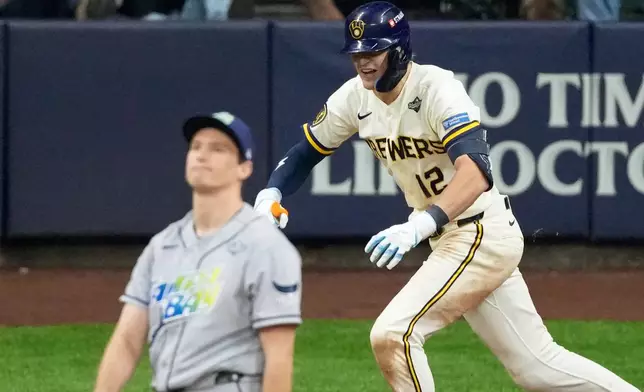 Milwaukee Brewers' Cooper Pratt celebrates a RBI-single during the seventh inning of Game 2 of baseball's World Series, Saturday, Oct. 24, 2026, in Milwaukee, between the Milwaukee Brewers and the Tampa Bay Rays. (AP Photo/David J. Phillip)