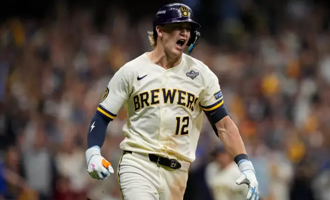 Milwaukee Brewers shortstop Cooper Pratt runs on his RBI base hit during the seventh inning of Game 2 of baseball's World Series, Saturday, Oct. 24, 2026, in Milwaukee, between the Milwaukee Brewers and the Tampa Bay Rays. (AP Photo/Ashley Landis)