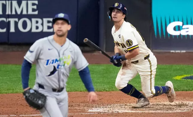 Milwaukee Brewers' Sal Frelick watches his home run during the sixth inning of Game 2 of baseball's World Series, Saturday, Oct. 24, 2026, in Milwaukee, between the Milwaukee Brewers and the Tampa Bay Rays. (AP Photo/David J. Phillip)