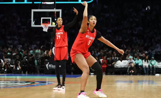 Atlanta Dream forward Angel Reese (5) and DeWanna Bonner (24) ask for a review during the second half of Game 3 of the WNBA basketball semifinals against the New York Liberty, Friday, Oct. 9, 2026, in New York. (AP Photo/Heather Khalifa)