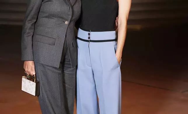 Carole Bouquet, left, and Marion Cotillard pose upon arrival at the Chanel Womenswear Spring Summer 2027 collection presented in Paris, France, Monday, Oct. 5, 2026. (AP Photo/Thomas Padilla)