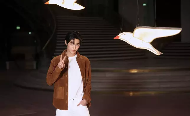 Keonho poses upon arrival at the Chanel Womenswear Spring Summer 2027 collection presented in Paris, France, Monday, Oct. 5, 2026. (AP Photo/Thomas Padilla)