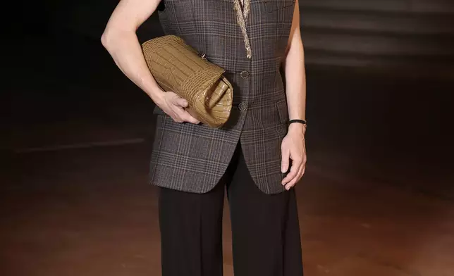 Sandra Huller poses upon arrival at the Chanel Womenswear Spring Summer 2027 collection presented in Paris, France, Monday, Oct. 5, 2026. (AP Photo/Thomas Padilla)