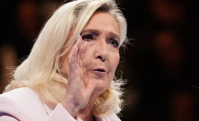 Leader of France's far-right National Rally (RN) party, Marine Le Pen, delivers a speech during the party's 19th Congress, in Orleans, France, Sunday, Oct. 25, 2026. (AP Photo/Teresa Suarez)