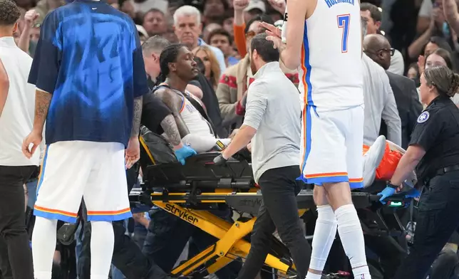 Oklahoma City Thunder guard Jalen Williams is taken off the court by medical staff during the second half of an NBA basketball game against the Los Angeles Clippers, Sunday, Oct. 25, 2026, in Oklahoma City. (AP Photo/Kyle Phillips)
