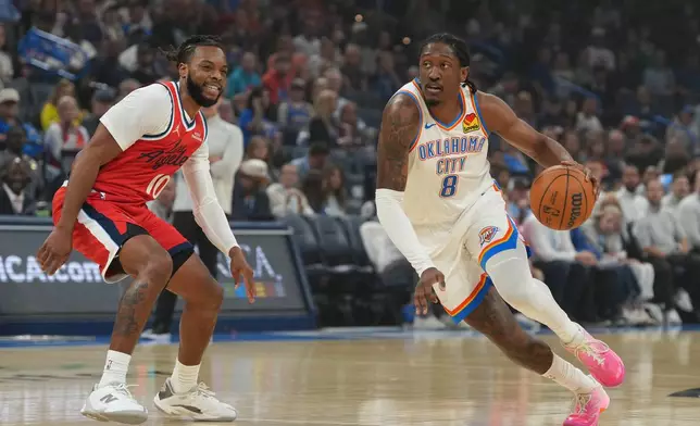 Oklahoma City Thunder guard Jalen Williams (8) drives past Los Angeles Clippers guard Darius Garland (10) during the first half of an NBA basketball game, Sunday, Oct. 25, 2026, in Oklahoma City. (AP Photo/Kyle Phillips)
