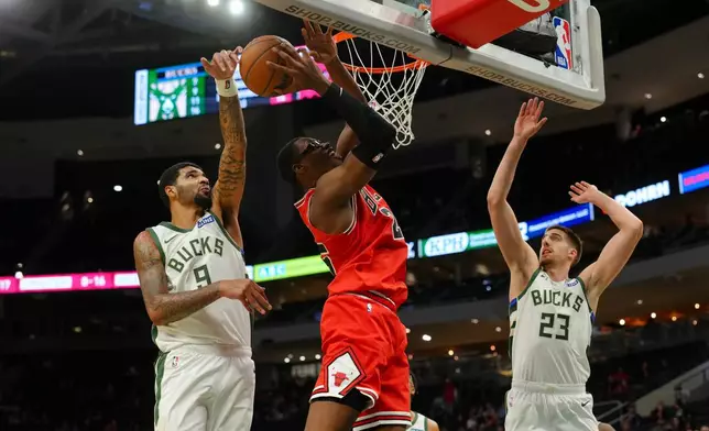 Milwaukee Bucks center Kel'el Ware (9) blocks the layup of Chicago Bulls forward Jalen Smith (25) during the first half of an NBA preseason basketball game, Wednesday Oct. 14, 2026, in Milwaukee. (AP Photo/Ross Harried)
