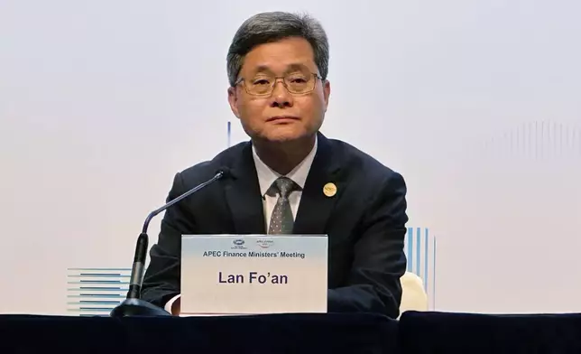 China's Finance Minister Lan Fo'an, chair of the 2026 APEC Finance Ministers' Meeting, holds a news conference at the Asia-Pacific Economic Cooperation (APEC) Finance Ministers' Meeting at the Hong Kong Convention and Exhibition Centre, Wednesday, Oct. 21, 2026. (AP Photo/Chan Ho-him)