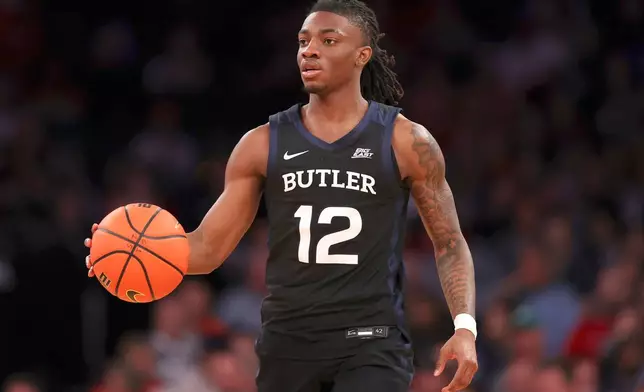 FILE - Butler guard Kolby King (12), who has since transferred to Auburn, dribbles during the second half of an NCAA college basketball game against St. John's in the quarterfinals of the Big East Conference tournament, Thursday, March 13, 2025, in New York. (AP Photo/Pamela Smith, File)