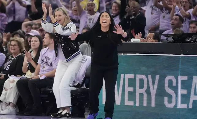 Golden State Valkyries head coach Natalie Nakase, middle, reacts toward players during the first half of Game 2 of the WNBA basketball semifinals against the Las Vegas Aces, Wednesday, Oct. 7, 2026, in San Francisco. (AP Photo/Jeff Chiu)