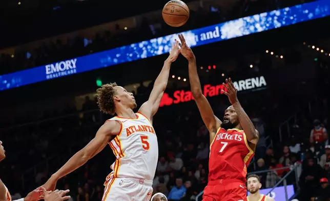 Houston Rockets forward Kevin Durant (7) shoots against Atlanta Hawks guard Dyson Daniels (5) during the first half of an NBA basketball game, Saturday, Oct. 24, 2026, in Atlanta. (AP Photo/Erik S. Lesser)