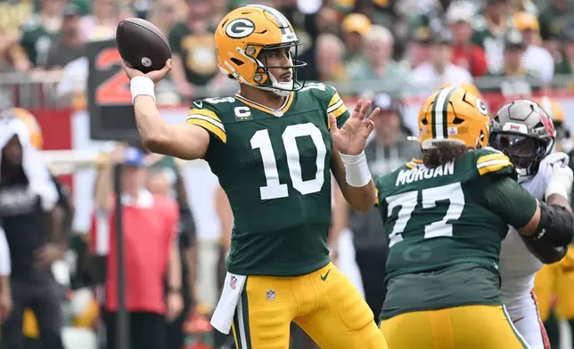 Green Bay Packers quarterback Jordan Love (10) aims a pass during the first half of an NFL football game against the Tampa Bay Buccaneers in Tampa, Fla., Sunday, Oct. 4, 2026. (AP Photo/Jason Behnken)
