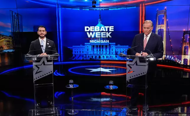 Democratic nominee for U.S. Senate Abdul El-Sayed, left, appears with Republican nominee for U.S. Senate Mike Rogers during a televised debate at WOOD-TV, on Thursday, Oct. 8, 2026, in Grand Rapids, Mich. (AP Photo/Paul Sancya, Pool)