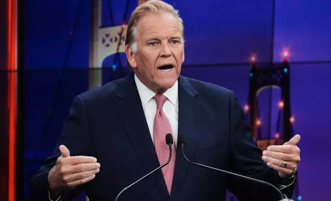 Republican nominee for U.S. Senate Mike Rogers, makes a point during a televised debate with Democratic nominee for U.S. Senate Abdul El-Sayed, at WOOD-TV, on Thursday, Oct. 8, 2026, in Grand Rapids, Mich. (AP Photo/Paul Sancya, Pool)