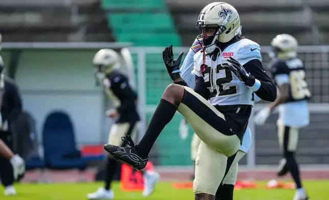 New Orleans Saints cornerback Martin Emerson Jr. (22) warms up during an NFL football practice session in Versailles near Paris, Wednesday, Oct. 21, 2026. (AP Photo/Aurelien Morissard)
