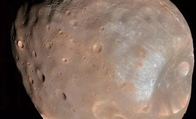 This photo provided by NASA/JPL-Caltech/University of Arizona, taken with NASA's Mars Reconnaissance Orbiter, shows Phobos, one of Mars' moons, on March 23, 2008. (NASA/JPL-Caltech/University of Arizona via AP)