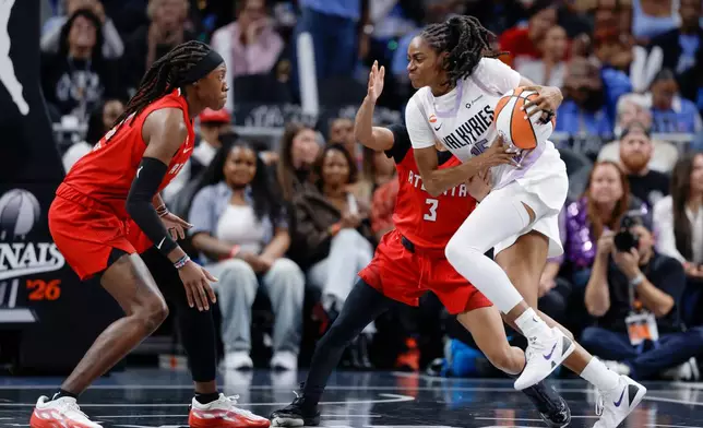Golden State Valkyries guard Tiffany Hayes (15) moves the ball while defended by Atlanta Dream guard Jordin Canada (3) during the first half in Game 6 of the WNBA basketball finals, Thursday, Oct. 29, 2026, in Atlanta. (Carlos Avila Gonzalez/San Francisco Chronicle via AP)