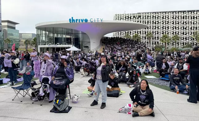 Fans attend the Golden State Valkyries’ watch party at Chase Center’s Thrive City plaza, Thursday morning, Oct. 29, 2026, in San Francisco, to watch a broadcast of Game 6 of the WNBA basketball finals against the Atlanta Dream. (AP Photo/Janie McCauley) Photo taken with a smartphone.