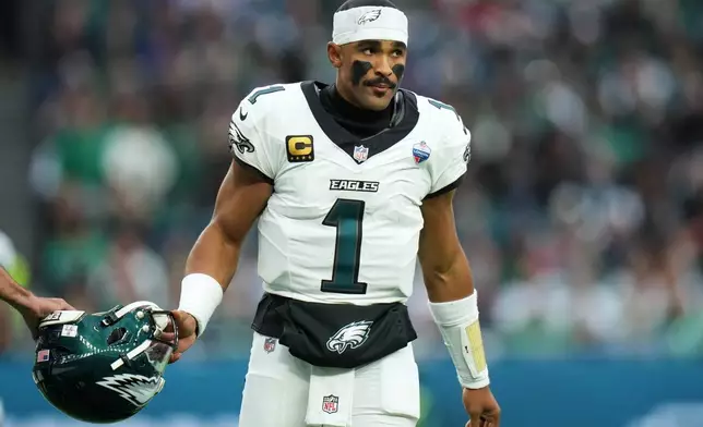 Philadelphia Eagles quarterback Jalen Hurts (1) stands on the field during an NFL football game against Jacksonville Jaguars in London, Sunday, Oct. 11, 2026. (AP Photo/Alastair Grant)
