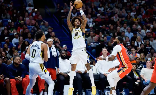 Indiana Pacers guard Kelly Oubre Jr. (10) shoots against New Orleans Pelicans guard Saddiq Bey (41) during the first half of an NBA basketball game in New Orleans, Wednesday, Oct. 21, 2026. (AP Photo/Matthew Hinton)