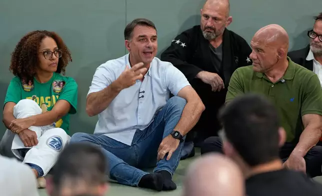 Opposition presidential candidate Sen. Flavio Bolsonaro meets with jiu-jitsu black belts as part of his campaign ahead of general elections in Sao Paulo, Tuesday, Sept. 29, 2026. (AP Photo/Andre Penner)