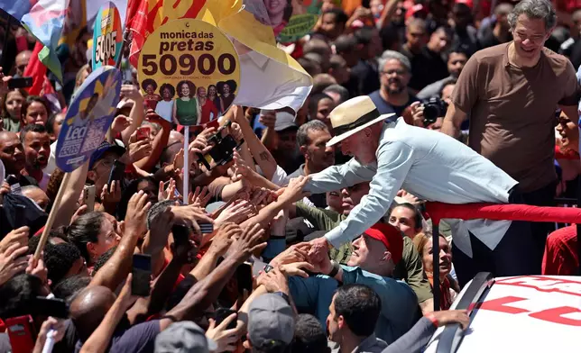 Brazilian President Luiz Inacio Lula da Silva, who is running for reelection, greets supporters during a campaign rally in Sao Paulo, Brazil, Saturday, Sept. 26, 2026. (AP Photo/Allison Sales)