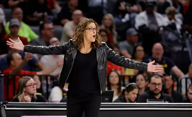 Indiana Fever head coach Stephanie White reacts to a call during the first half in Game 3 of an WNBA basketball first-round playoff series against the Las Vegas Aces Thursday, Oct.1, 2026, in Las Vegas. (AP Photo/Steve Marcus)