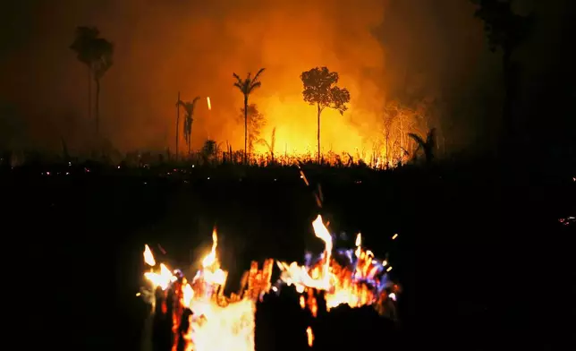 Wildfires burn in the municipality of Autazes, Amazonas state, Brazil, Monday, Oct. 12, 2026. (AP Photo/Edmar Barros)